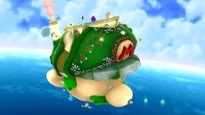 Review Super Mario Galaxy 2: De "overworld" is flink veranderd: je reist nu in 2D stijl van galaxy naar galaxy met dit schip, wat verrassend veel op Mario’s hoofd lijkt!